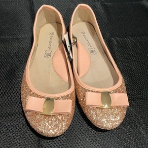 Rose gold flats.